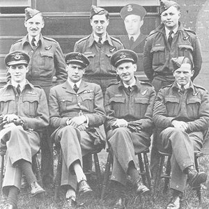 Nettleton's crew after the mission to Augsburg, standing, left to right, L H Mutter, F H Harrison, C S C McClure (inset), D N Huntley, seated, P A Dorehill, J D Nettleton, D O Sands and C F Churchill